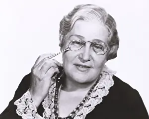 Lorgnette: Woman holding lorgnette