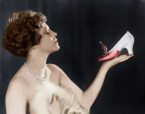 Emotional: Woman holding shoe