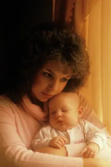 Tay001: Woman holding sleeping baby