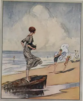 Kodak: Woman holds Camera on the Beach