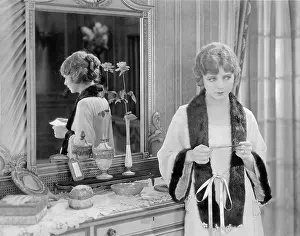 Bathrobe: Woman at home reading note