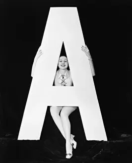 Vowels: Woman with huge letter A