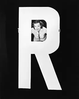 Peeking: Woman with huge letter R