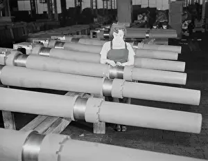 Inspecting: Woman inspecting one of the 25 cutters for