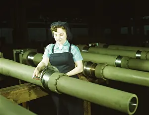 Inspecting: Woman inspecting one of the 25 cutters for