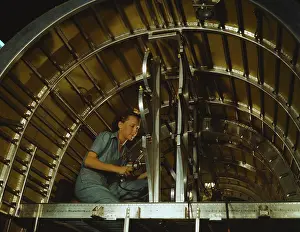 Confined: Woman installing oxygen racks in an aircraft