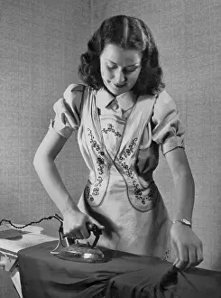 Irons: A woman irons, 1942
