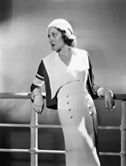 Passivity: Woman leaning against railing