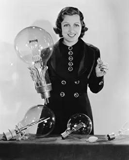 Lightbulb: Woman with light bulbs in various shapes and sizes