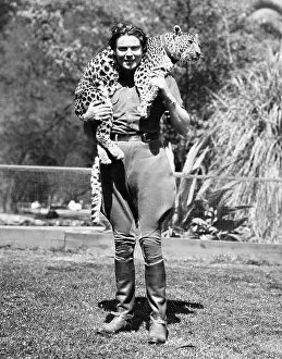 Everett Collection (old Visuals): Woman with a live leopard around her neck