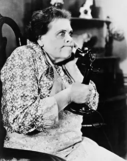 Displeasure: Woman looking angry and talking on the phone