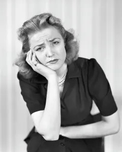 Toothache: Woman looking at Camera with a Sad Disgruntled Face
