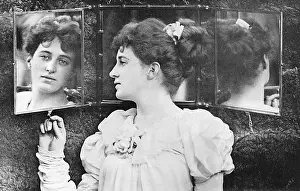 Hath: Woman looking through mirror at her reflection