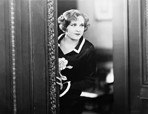 Abode: Woman looking into a room