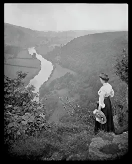 Woman looking down into a valley