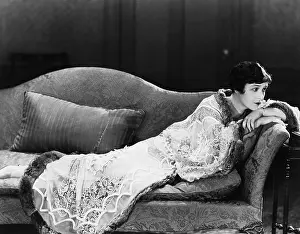Brood: Woman lying on couch