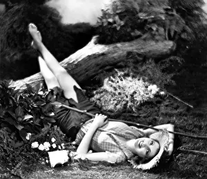 Time Off: Woman lying on the ground and smiling