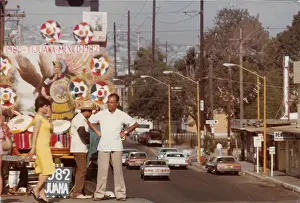 Tijuana: Woman and two men standing on the float above the street