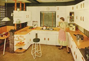 Shelves: Woman in a modern fitted kitchen