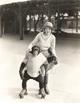 1910s 1940s: Woman with monkey on roller skates