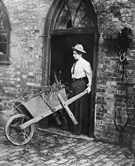 Manure: Woman mucking out a stable