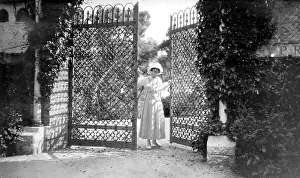 Elaborate: Woman opening a gate