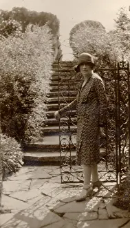 Wrought: A woman opens a gate