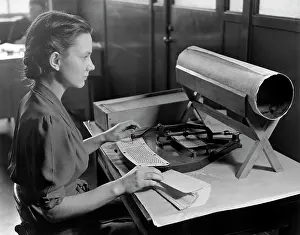 File: Woman operating a card puncher