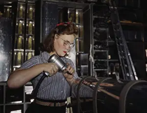 Stability: Woman operating a hand drill while assembling