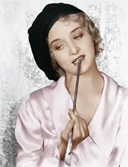 Paintbrush: Woman with a paintbrush between her teeth