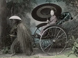 Jinrikisha: Woman with parasol, rickshaw pulled by man in grass coat