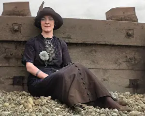 Breakwater: Woman on a pebbly beach
