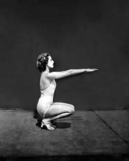 Squat: Woman performing squat thrust