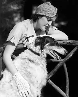 Borzoi: Woman petting her Borzoi
