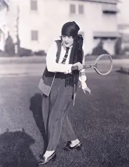 150724: Woman playing badminton outdoors