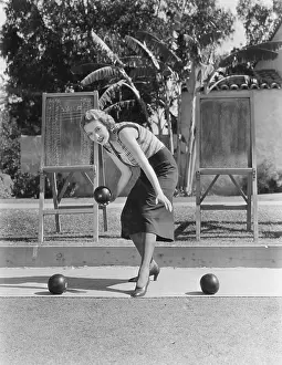 Bocce: Woman playing bocce outdoors