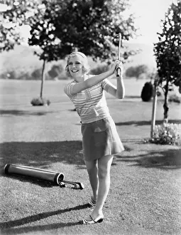 Blonds: Woman playing golf on a golf course