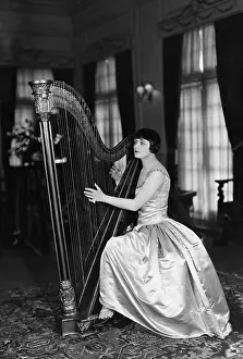 Harpist: Woman playing harp