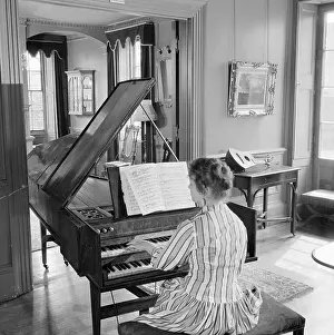 Harpsichords: Woman Playing A Harpsichord