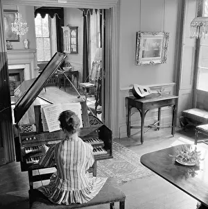 Harpsichords: Woman Playing A Harpsichord