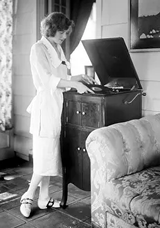 Victrola: Woman playing a record, circa 1930s. ?