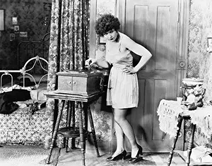 Seducing: Woman playing record player