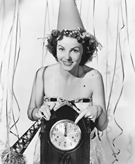 Streamer: Woman pointing at the clock at midnight