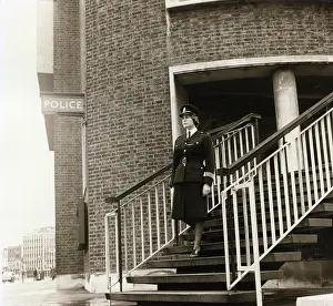 Lambeth: Woman police officer leaving police station, London