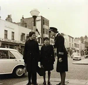 Belisha: Woman police officer on traffic duty, London