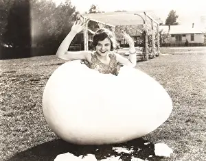 Popping: Woman popping out of giant egg