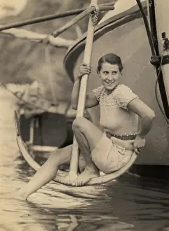 Ros Fraser Collection: Woman poses on anchor