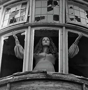 Panes: Woman posing with broken windows