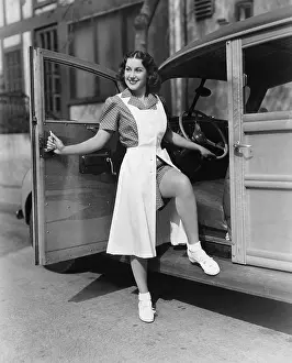 Sensuality: Woman posing at door of car