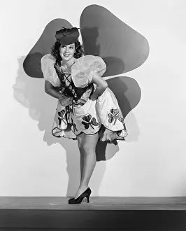 Shamrocks: Woman posing in front of large shamrock
